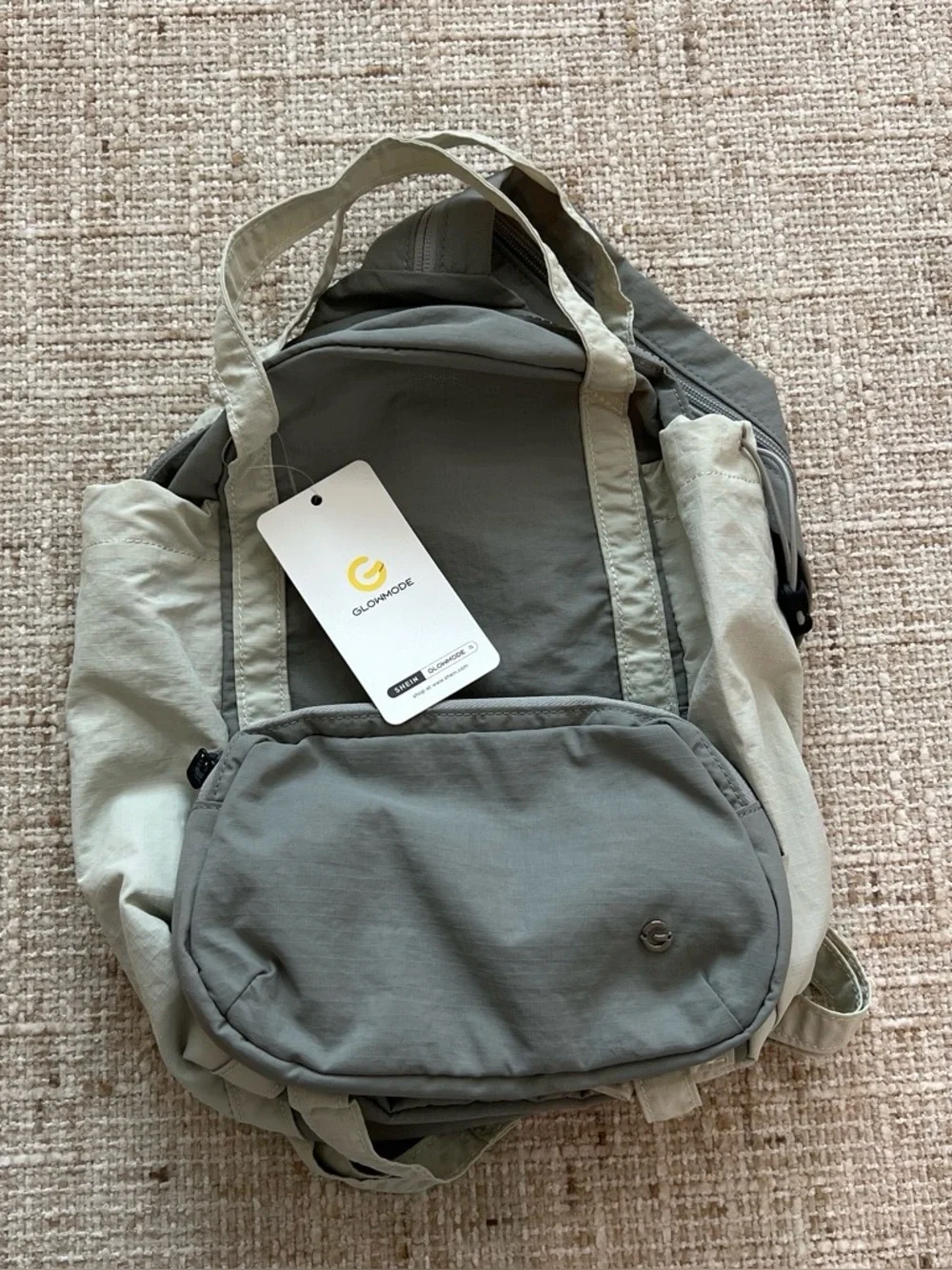 Glowmode gray backpack with detachable pouch and separate zip strap